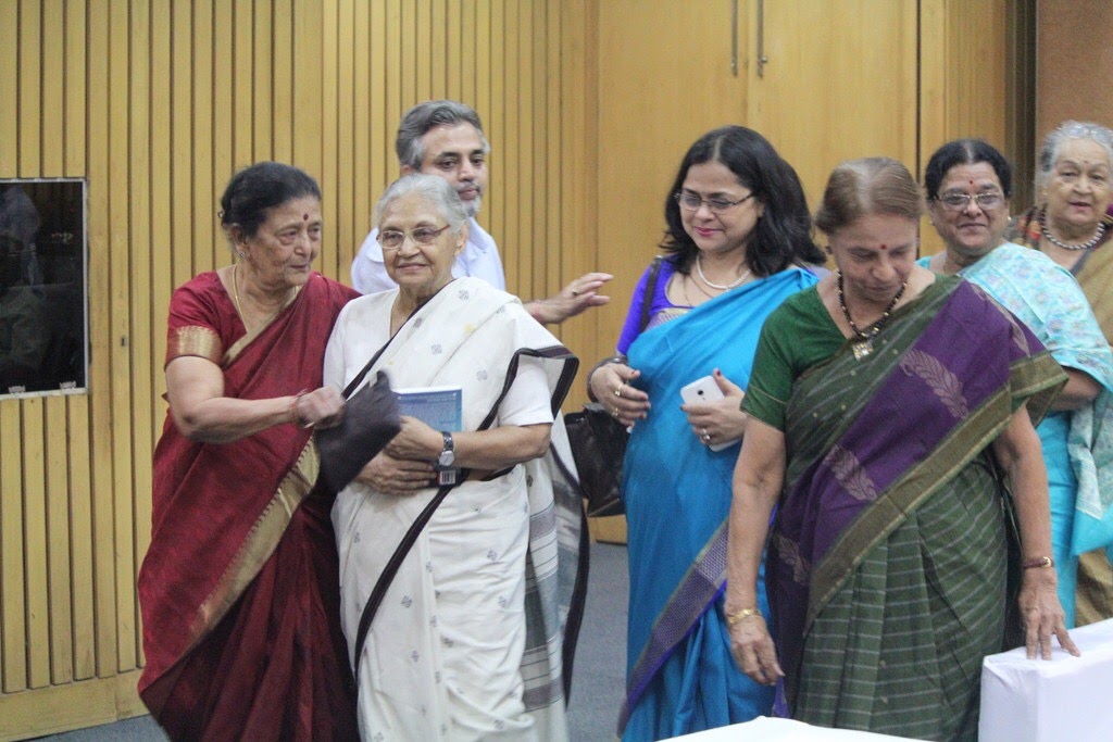 Dr. Meenakshi Kumar with dignitaries at a women's empowerment event